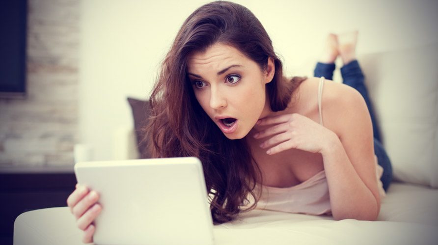 woman on computer shocked