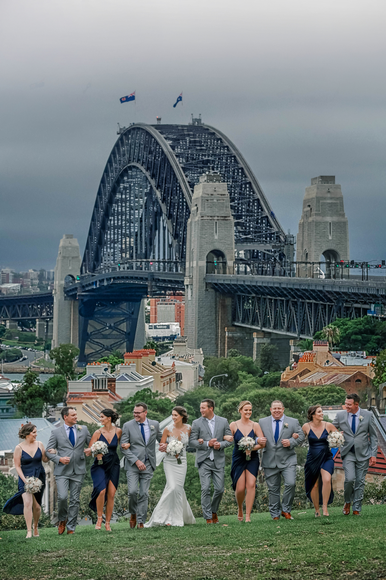 Beautiful shot of the entire wedding party in front of the Sydney harbour bridge
