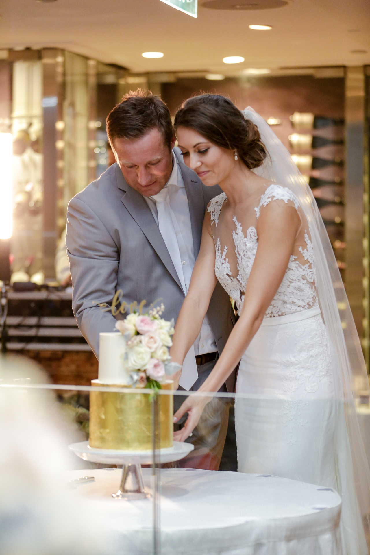 Sydney wedding cake is cut by bride and groom