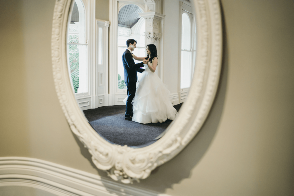 A mirror's reflection of Sophia and Kyle dancing