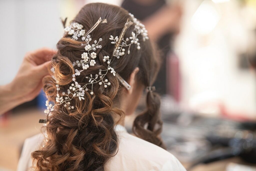 A woman getting ready for her wedding hairstyle